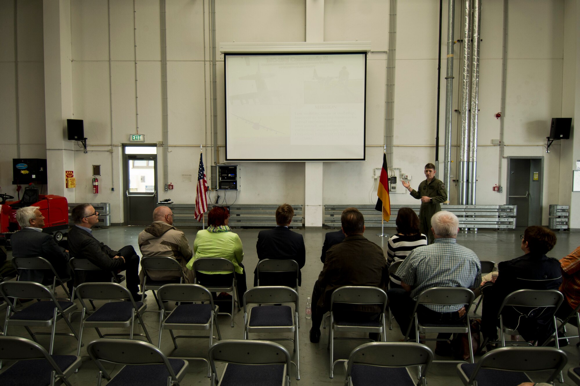 U.S. Air Force Lt. Col. Scott Wilson, 352nd Special Operations Wing director of staff, gives a presentation about CV-22 Osprey tilt-rotor aircaft assigned to his wing during a presentation to local German community leaders on the flightline near the 726th Air Mobility Squadron at Spangdahlem Air Base, Germany, June 28, 2016. The 352nd SOW, currently stationed at Royal Air Force Mildenhall, United Kingdom, will relocate to Spangdahlem as part of the European Infrastructure Consolidation realignment slated over the coming years. (U.S. Air Force Photo by Staff Sgt. Joe W. McFadden/Released)