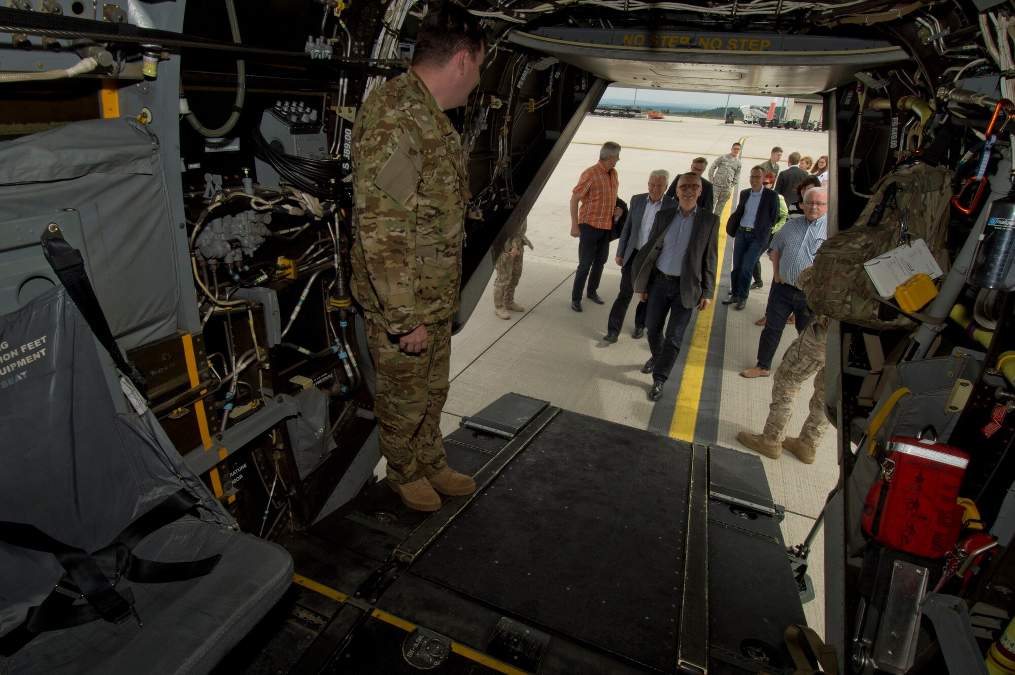 Local German community leaders view a CV-22 Osprey tilt-rotor aircaft assigned to the 352nd Special Operations Wing during a presentation on the flightline near the 726th Air Mobility Squadron at Spangdahlem Air Base, Germany, June 28, 2016. The 352nd SOW, currently stationed at Royal Air Force Mildenhall, United Kingdom, will relocate to Spangdahlem as part of the European Infrastructure Consolidation realignment slated over the coming years. (U.S. Air Force Photo by Staff Sgt. Joe W. McFadden/Released)