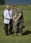 U.S. Marine Corps Lt. Gen. John E. Wissler, right, commander of U.S. Marine Forces Command, shakes hands with Maj. Gen. Robert C. Dickerson, retired, during the 2nd MLG change of command ceremony at Camp Lejeune, N.C., June 8, 2016. U.S. Marine Corps Brig. Gen. Charles G. Chiarotti relinquished command to Col. Daniel P. O’Hora. (U.S. Marine Corps photo by Lane Cpl. Samantha A. Barajas)
