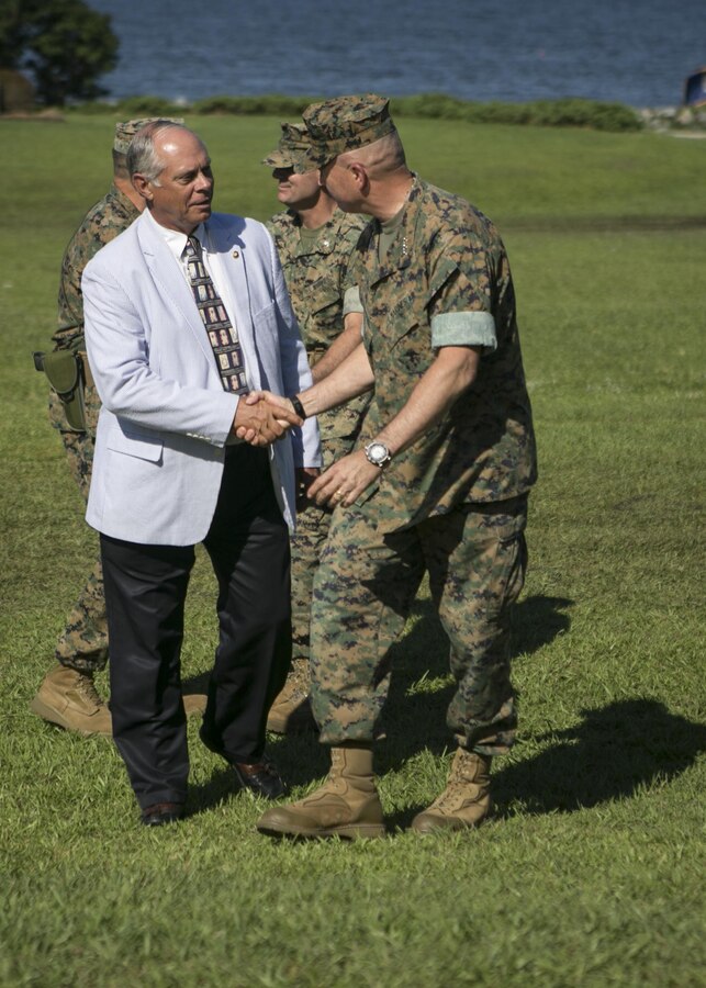 U.S. Marine Corps Lt. Gen. John E. Wissler, right, commander of U.S. Marine Forces Command, shakes hands with Maj. Gen. Robert C. Dickerson, retired, during the 2nd MLG change of command ceremony at Camp Lejeune, N.C., June 8, 2016. U.S. Marine Corps Brig. Gen. Charles G. Chiarotti relinquished command to Col. Daniel P. O’Hora. (U.S. Marine Corps photo by Lane Cpl. Samantha A. Barajas)