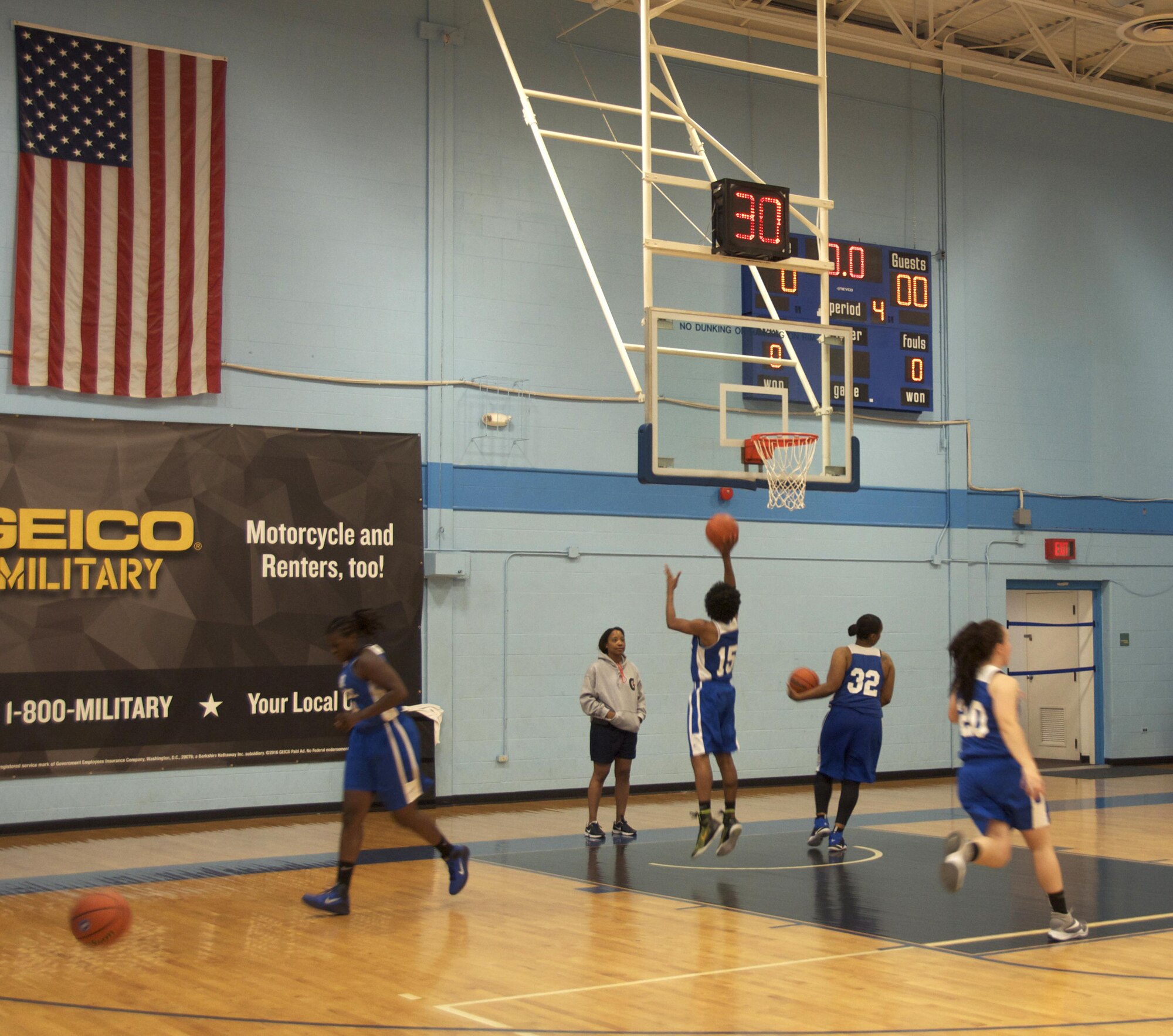 Master Sgt. Tashon Taylor, All-Air Force Women’s Basketball Team assistant coach, watches her players run a drill during practice recently. (U.S. Air Force Photo/Steve Warns/Released)