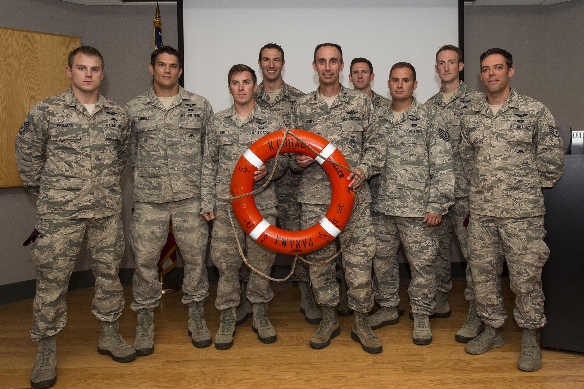 U.S. Air Force Maj. Gen. Scott Zobrist, Ninth Air Force commander, poses for a photo with Airmen from the 38th Rescue Squadron during his visit, June 28, 2016, at Moody Air Force Base, Ga. Zobrist thanked and coined the Airmen for their fearless efforts during a search and recovery mission last week. (U.S. Air Force photo by Senior Airman Ceaira Young/Released)