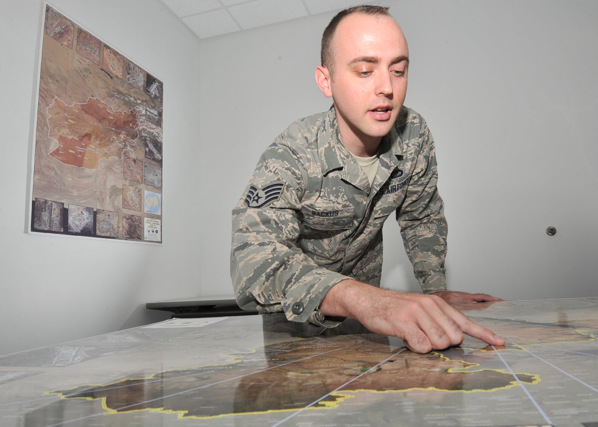 Staff Sgt. Patrick Backus, 772nd Enterprise Sourcing Squadron contracting specialist, identifies locations on a map where he provides support services at the Air Force Civil Engineer Center, June 23, 2016. As a contract specialist, Backus’ role is to purchase contractor support and monitor contractor performance. Backus currently maintains contract oversight for task orders in Afghanistan as well as other areas of responsibility. These sites otherwise known as Areas of Responsibility are deployed locations that require support from outside contract organizations. (U.S. Air Force photo by Senior Airman Ty-Rico Lea/Released)