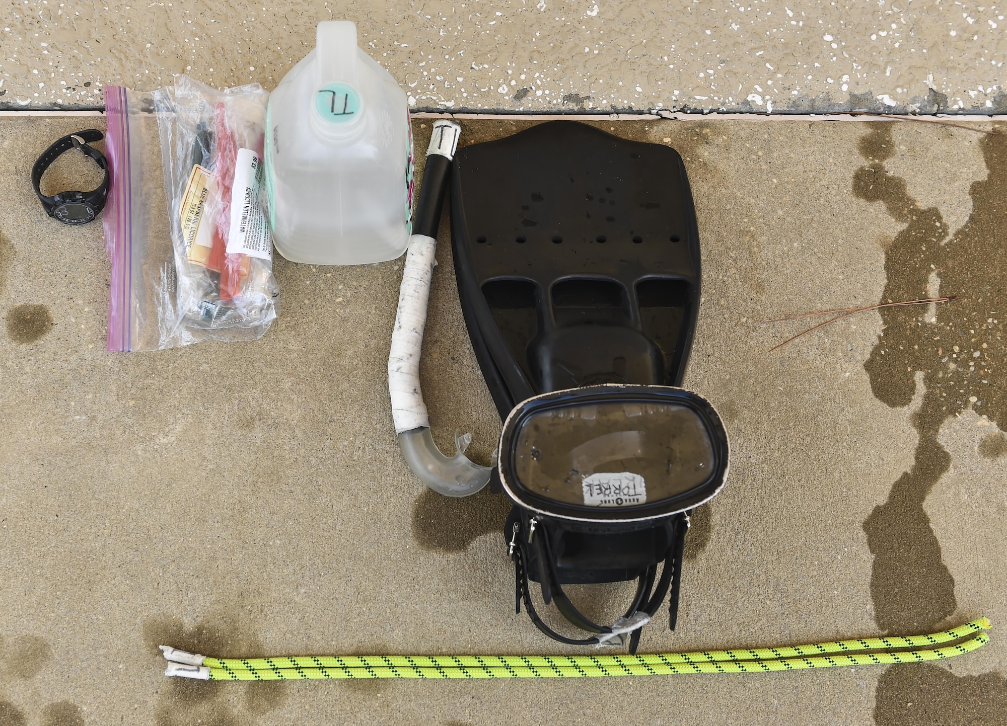 A Special Tactics Training Squadron student’s equipment is laid out during a pre-scuba class at Hurlburt Field, Fla., June 29, 2016. The purpose of this training is to familiarize the trainees with the basics of water operations. The training familiarizes trainees with the basics of water operations. The trainees perform tasks such as tying knots underwater, learning how to stay afloat without their arms and hands, and how to use snorkeling gear. Special Tactics students later apply this knowledge to combat dive training. This training also reproduces physiological effects similar those experienced on the battlefield, and thus builds the necessary mental resiliency for ground special operations force. (U.S. Air Force photo by Senior Airman Ryan Conroy) 