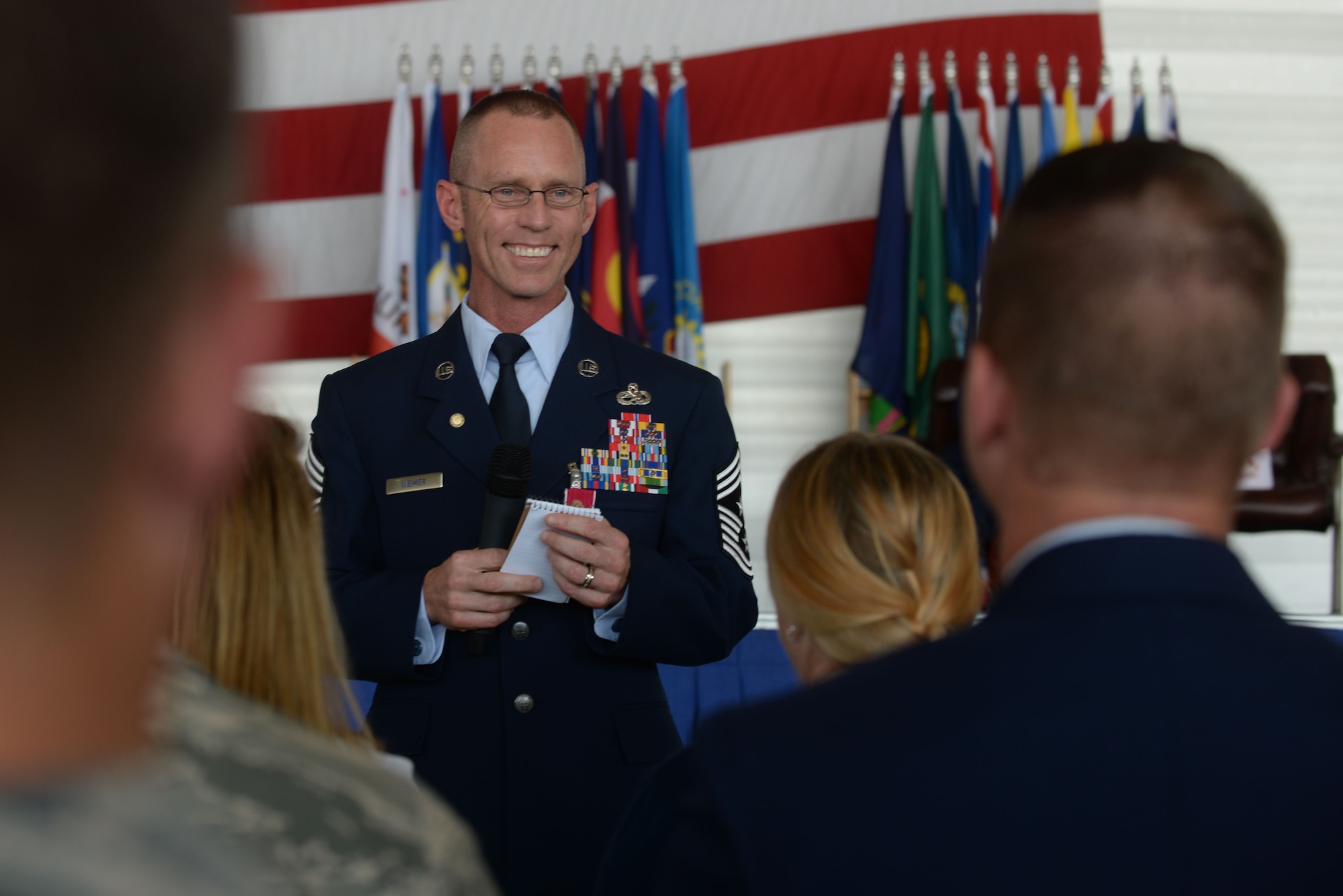 Chief Master Sgt. Geoff Weimer thanks his family for their support at his retirement ceremony at Minot Air Force Base, N.D., June 24, 2016. Weimer served as the command chief of the 5th Bomb Wing for the last two years. (U.S. Air Force photo/Airman 1st Class Jessica Weissman)