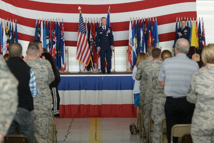 Chief Master Sgt. Geoff Weimer is applauded during his retirement ceremony at Minot Air Force Base, N.D., June 24, 2016. Weimer celebrated his 29 years of service with his final flight of a B-52 Stratofortress June 23. (U.S. Air Force photo/Airman 1st Class Jessica Weissman)