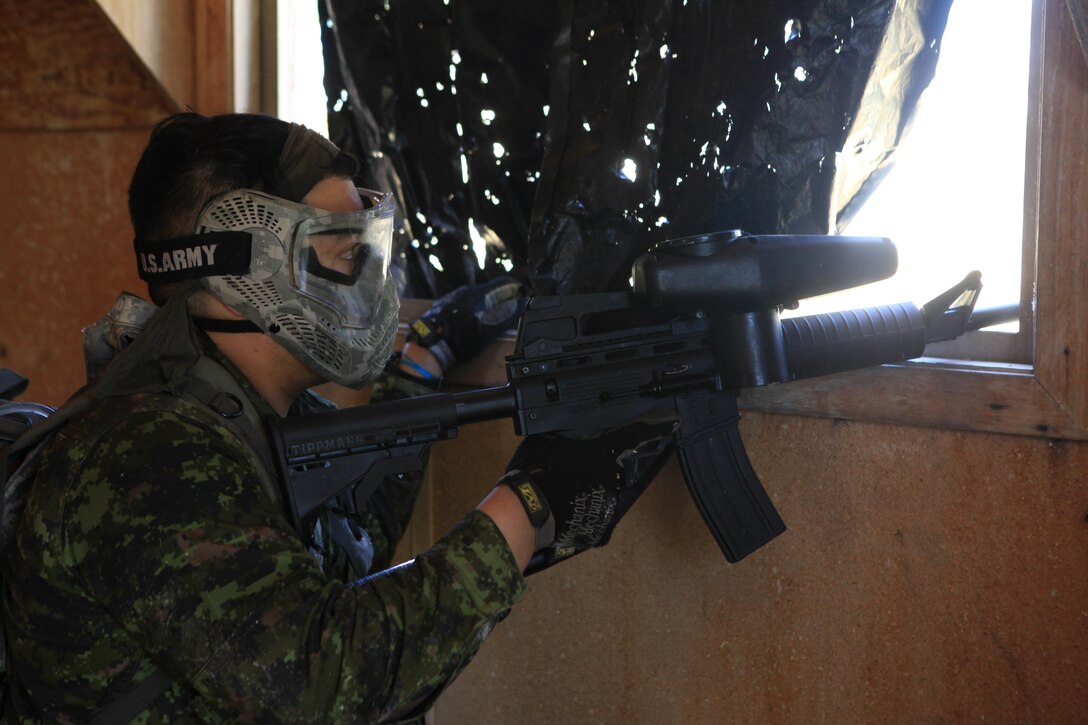 Canadian Army Cpl. Joshua Solis, assigned to the 1515 Field Ambulance, Task Force 41, reacts to contact in a simulated urban wareface during Golden Coyote exercise at the South Dakota National Guard West Camp Rapid training facility, Rapid City, S.D., June 18, 2016. The Golden Coyote exercise is a three-phase, scenario-driven exercise conducted in the Black Hills of South Dakota and Wyoming, which enables commanders to focus on mission essential task requirements, warrior tasks and battle drills. (U.S. Army photo by Spc. Bryant Abel/Released)