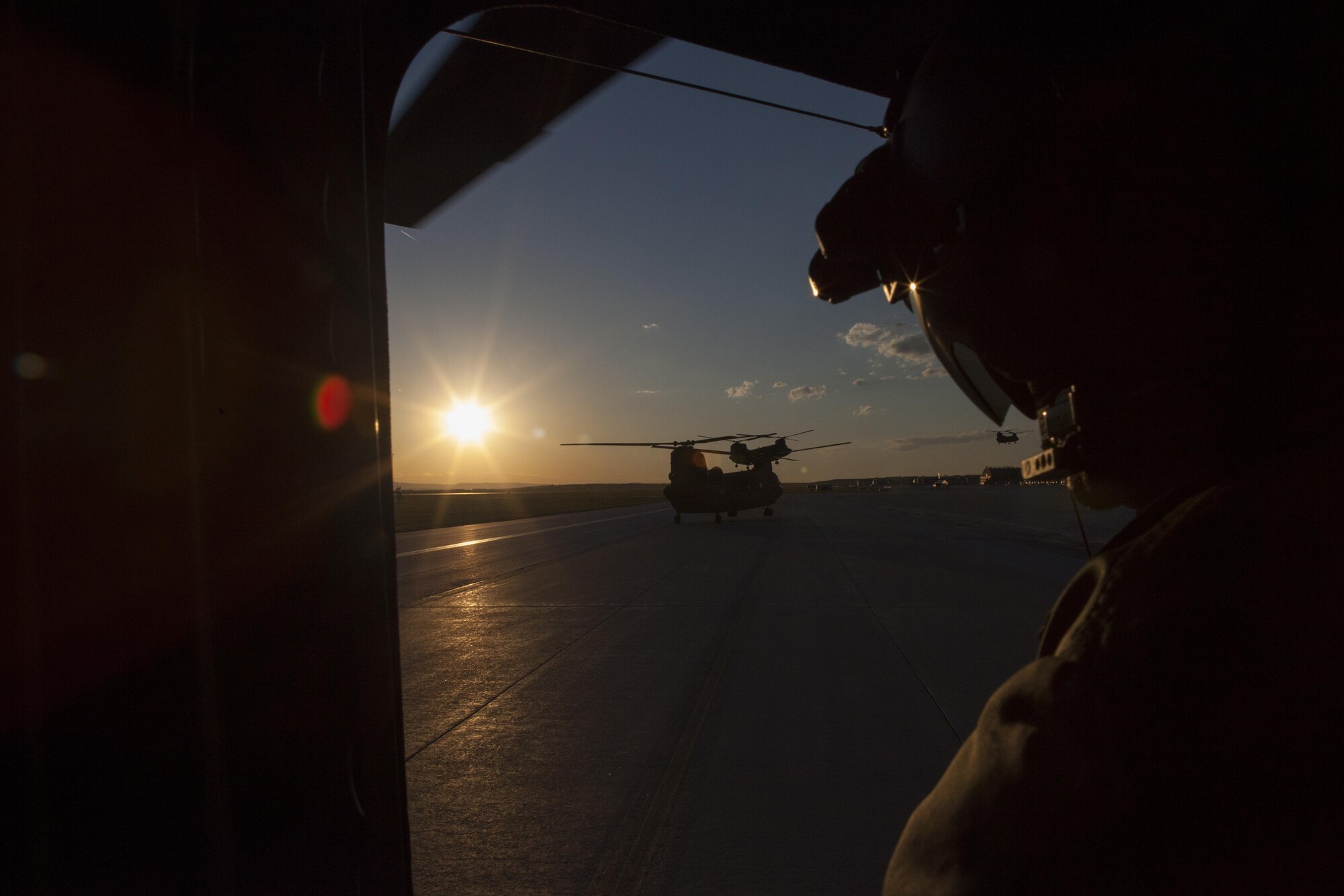 Three Republic of Singapore Air Force CH-47 D Chinook helicopters return to Ellsworth Air Force Base, S.D., after performing sling load operations in support of the Golden Coyote training exercise at South Dakota National Guard West Camp Rapid training facility, Rapid City, S.D., June 14, 2016. The Golden Coyote exercise is a three-phase, scenario-driven exercise conducted in the Black Hills of South Dakota and Wyoming, which enables commanders to focus on mission essential task requirements, warrior tasks and battle drills. (U.S. Army photo by Spc. Kristen Root/Released)