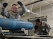 Senior Airman Justin Anthony, 28th Munitions Squadron conventional maintenance crew chief, left, assists Chief Master Sgt. Sonia Lee, 28th Bomb Wing command chief, in loading an FM-152 fuse into an inert GBU-38 v1 during an immersion tour at Ellsworth Air Force Base, S.D., June 27, 2016. Ellsworth’s conventional maintenance crews take an average of 25 minutes to build the 500-pound munition. (U.S. Air Force photo by Airman 1st Class Sadie Colbert/Released)