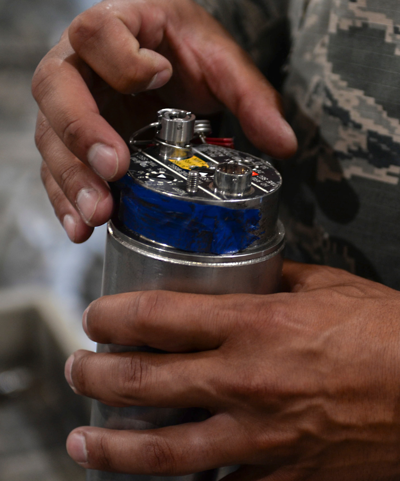 Senior Airman Justin Anthony, 28th Munitions Squadron conventional maintenance crew chief, left, assists Chief Master Sgt. Sonia Lee, 28th Bomb Wing command chief, in loading an FM-152 fuse into an inert GBU-38 v1 during an immersion tour at Ellsworth Air Force Base, S.D., June 27, 2016. Ellsworth’s conventional maintenance crews take an average of 25 minutes to build the 500-pound munition. (U.S. Air Force photo by Airman 1st Class Sadie Colbert/Released)