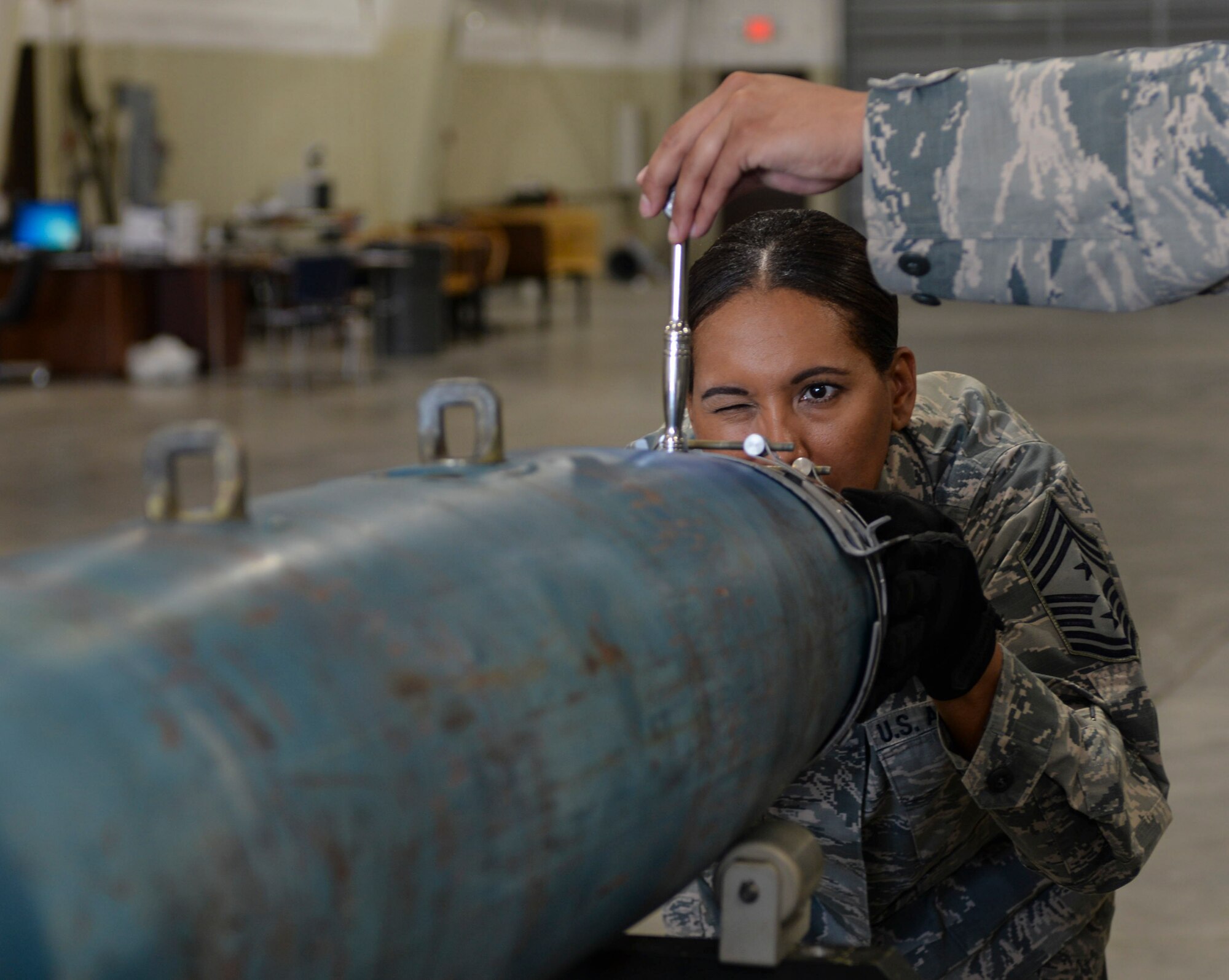 Senior Airman Justin Anthony, 28th Munitions Squadron conventional maintenance crew chief, left, assists Chief Master Sgt. Sonia Lee, 28th Bomb Wing command chief, in loading an FM-152 fuse into an inert GBU-38 v1 during an immersion tour at Ellsworth Air Force Base, S.D., June 27, 2016. Ellsworth’s conventional maintenance crews take an average of 25 minutes to build the 500-pound munition. (U.S. Air Force photo by Airman 1st Class Sadie Colbert/Released)