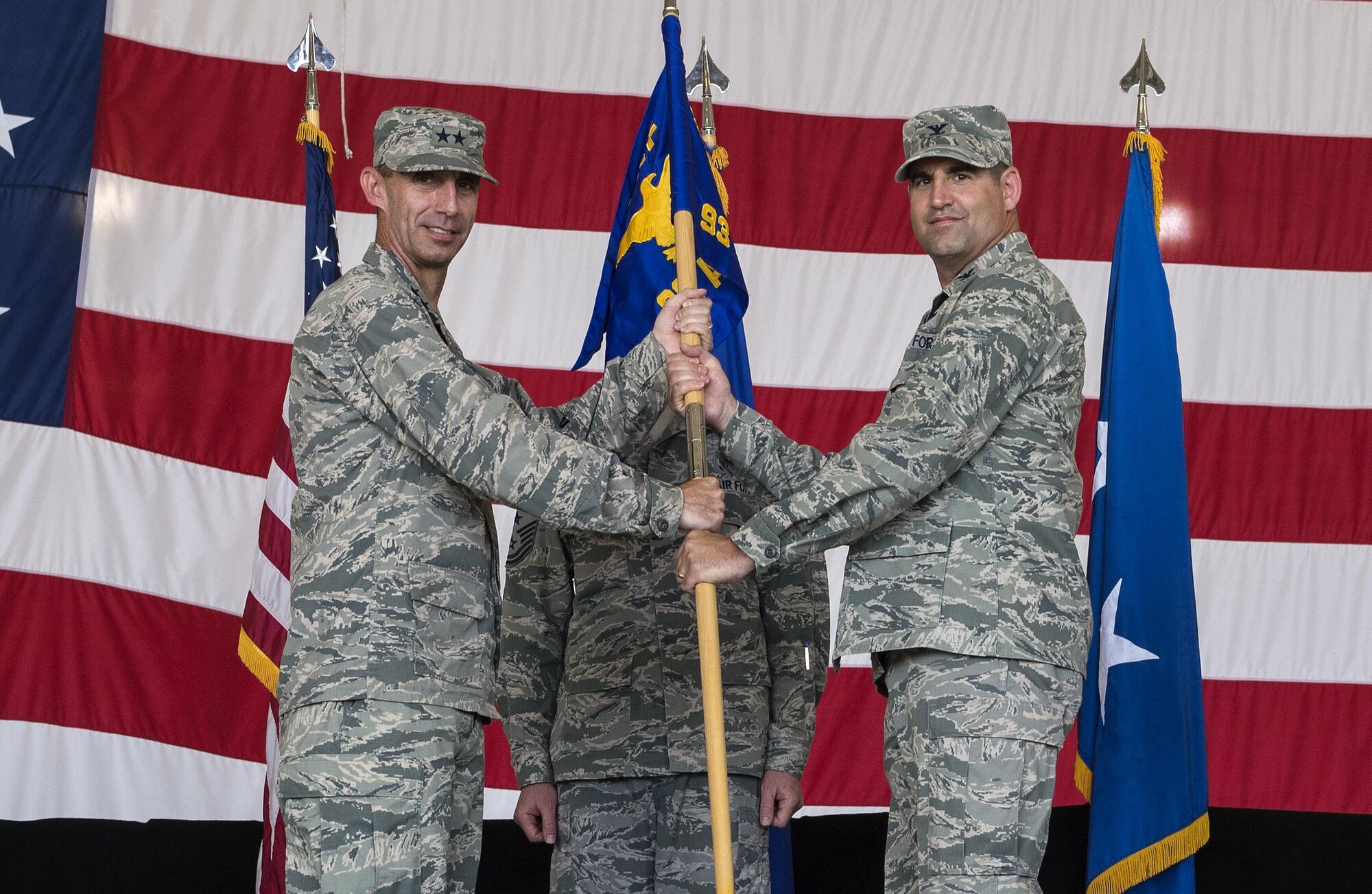 U.S. Air Force Maj. Gen. Scott Zobrist, Ninth Air Force commander, hands the guidon to Col.  Jeffery Valenzia, incoming 93d Air Ground Operations Wing commander, June 28, 2016, at Moody Air Force Base, Ga. Valenzia has served at the Pentagon, Washington D.C., as a Special Assistant to the Chairman of the Joint Chiefs of Staff, and as the vice commander for the 8th Fighter Wing at Kunsan Air Base, Republic of Korea. (U.S. Air Force photo by Airman 1st Class Janiqua P. Robinson/Released)