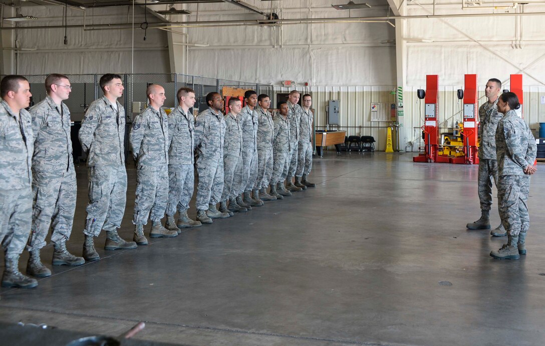 Senior Airman Justin Anthony, 28th Munitions Squadron conventional maintenance crew chief, left, assists Chief Master Sgt. Sonia Lee, 28th Bomb Wing command chief, in loading an FM-152 fuse into an inert GBU-38 v1 during an immersion tour at Ellsworth Air Force Base, S.D., June 27, 2016. Ellsworth’s conventional maintenance crews take an average of 25 minutes to build the 500-pound munition. (U.S. Air Force photo by Airman 1st Class Sadie Colbert/Released)