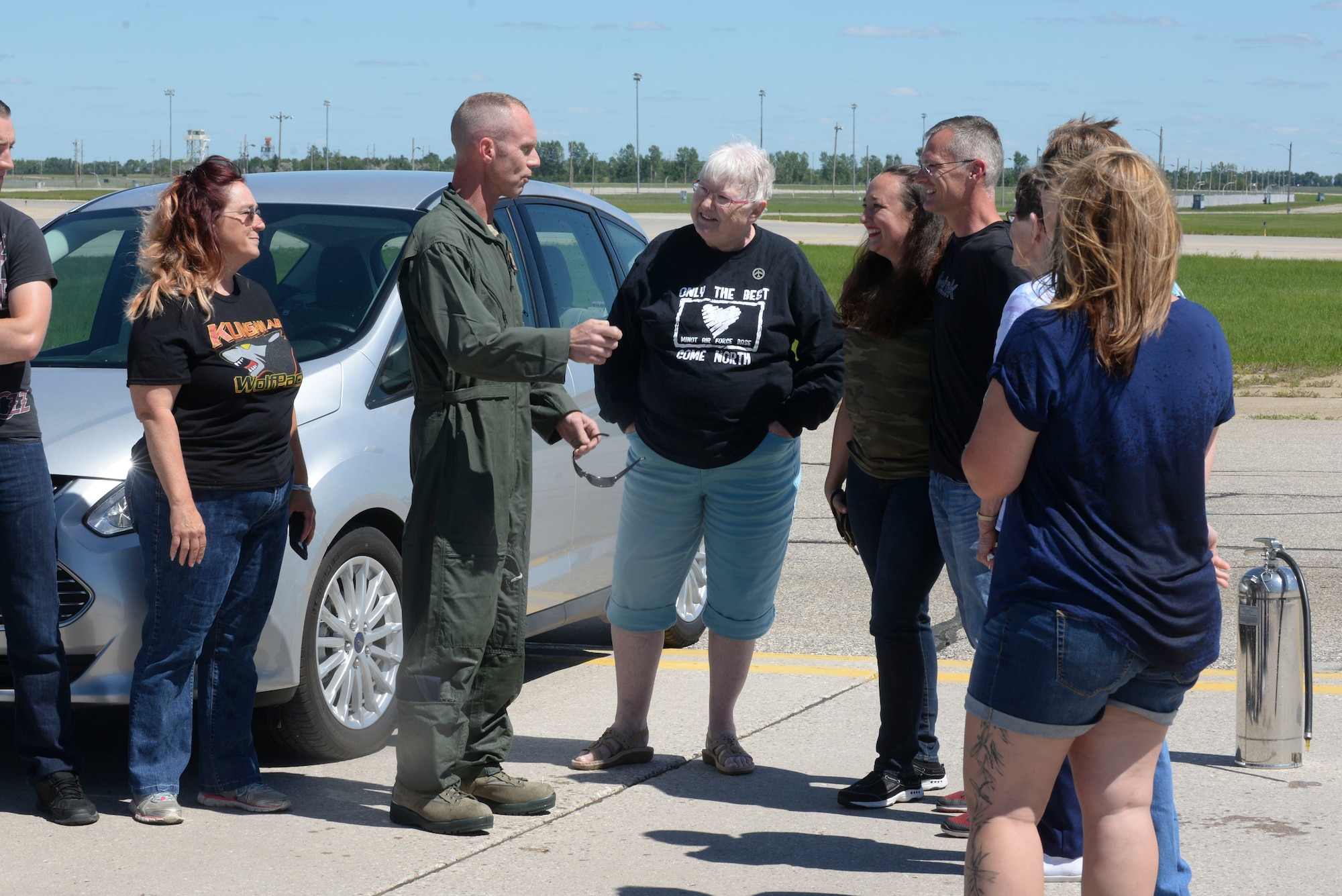Chief Master Sgt. Geoff Weimer talks with family and friends after celebration of his “fini-flight” at Minot Air Force Base, N.D., June 23, 2016. Weimer retired from active duty June 24 after 29 years of service to the Air Force. (U.S. Air Force photo/Airman 1st Class Jessica Weissman)