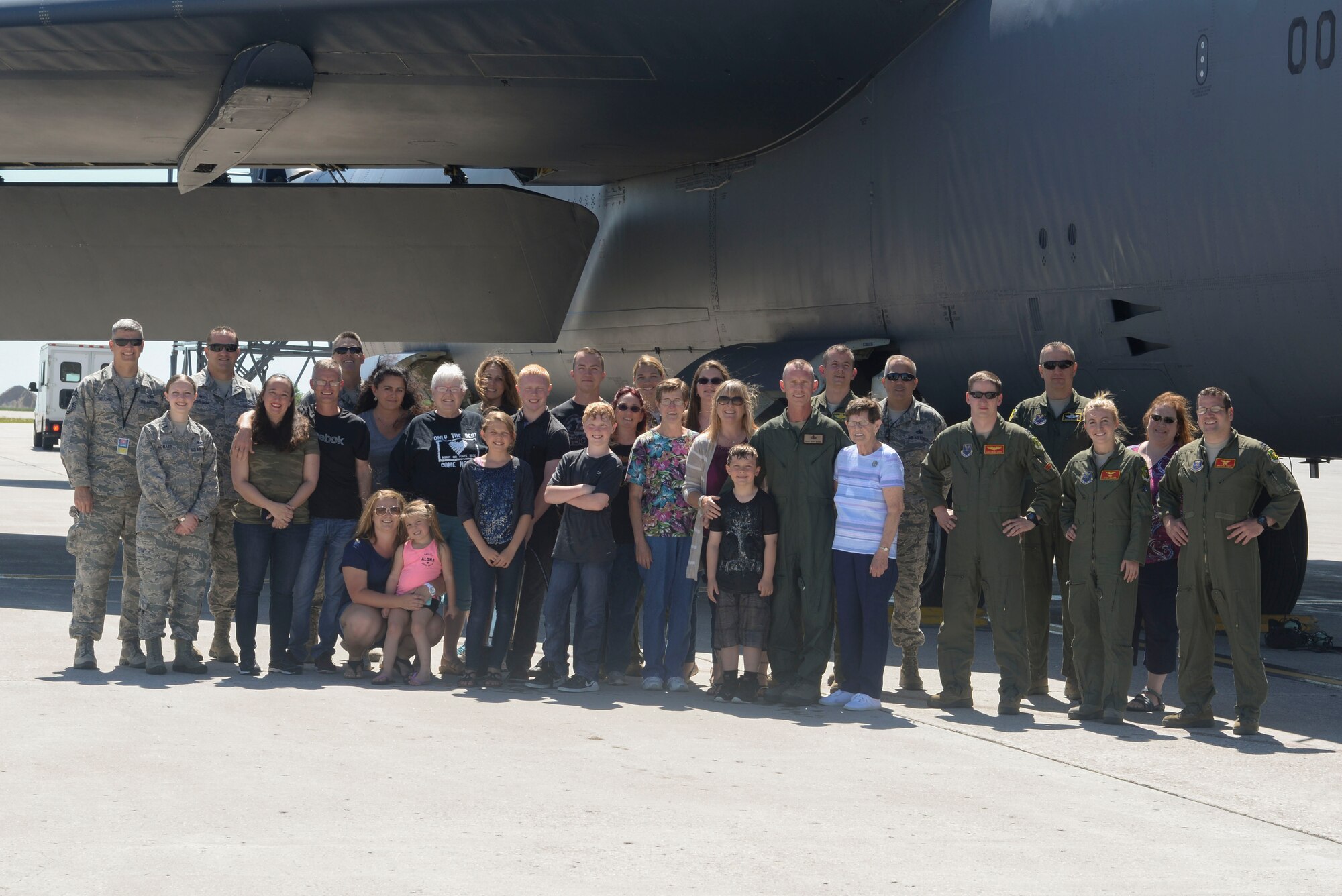 Chief Master Sgt. Geoff Weimer poses with his family, friends and Airmen from Minot Air Force Base, N.D., after celebration of his “fini-flight” June 23, 2016. The “fini-flight” is the final flight taken by an aircrew member at his current assignment. (U.S. Air Force photo/Airman 1st Class Jessica Weissman)