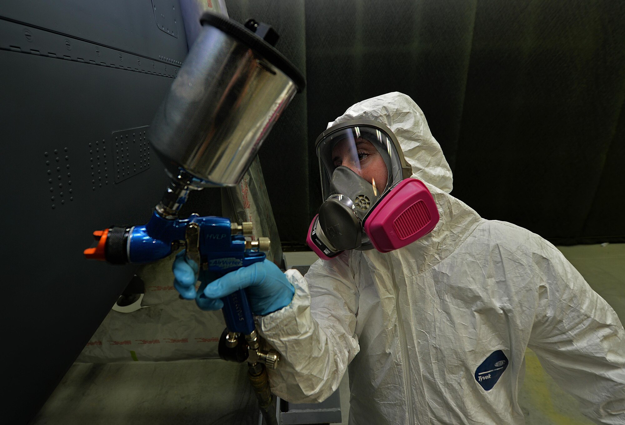 Airman 1st Class Taylor Hill, an aircraft structural maintenance journeyman with the 1st Special Operations Maintenance Squadron, prepares to paint an engine kit with an air vector spray paint-gun at Hurlburt Field, Fla., June 29, 2016. The air vector spray paint gun uses the pressure of air to paint surfaces to restore aircraft and prevent corrosion. (U.S. Air Force photo by Senior Airman Andrea Posey)