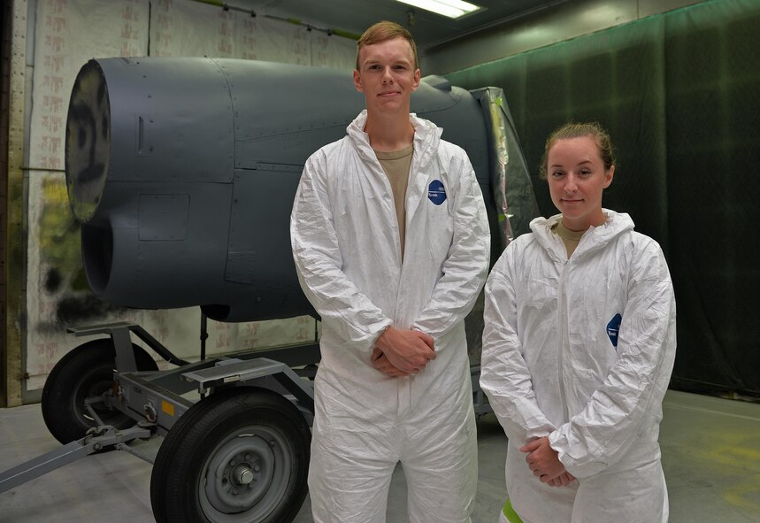 Airman Jay Adams and Airman 1st Class Taylor Hill, aircraft structural maintenance journeymen with the 1st Special Operations Maintenance Squadron, stand with a freshly painted engine kit at Hurlburt Field, Fla., June 29, 2016. Corrosion specialists are responsible for repairing and preventing corrosion to restore the structural integrity of aircraft. (U.S. Air Force photo by Senior Airman Andrea Posey)