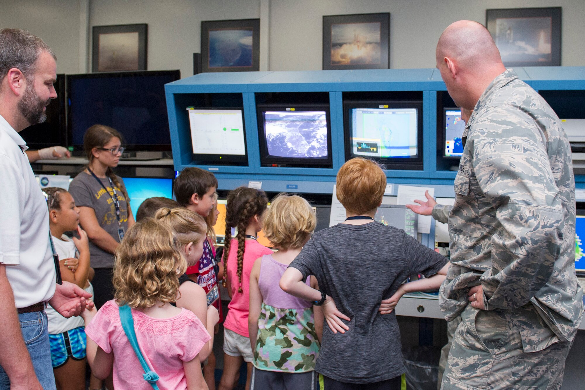Members of the 45th Weather Squadron demonstrate how the weatherbot works during a Young Minds at Work session June 30, 2016, at Cape Canaveral Air Force Station, Fla. Children toured the Morrell Operations Center and learned about how the Air Force supports the unique operation for each rocket launch mission. Airmen teamed up with Lockheed Martin to showcase Air Force capabilities to encourage children to get interested in the study of Science, Technology, Engineering, and Math (STEM). 