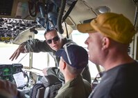 Lt. Devin Keigley, a pilot with the 757th Airlift Squadron here, explains the controls of a C-130H Hercules aircraft to honorary 2nd Lt. Corbin Burggraf, the 910th Airlift Wing’s 63rd Pilot for a Day, and Corbin’s father George here, June 29. The Pilot for a Day program welcomes children with life threatening or chronic illnesses to Youngstown Air Reserve Station for a day of fun military experiences. Keigley was Burggraf’s pilot escort for his day at YARS. (U.S. Air Force photo/Eric White)