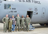 Honorary 2nd Lt. Corbin Burggraf (second from left), the 910th Airlift Wing’s 63rd Pilot for a Day, and his dad George pose for a photo with aircrew members by the crew door of a C-130H Hercules aircraft here, June 29. Corbin and George were taken on a runway taxi as part of the Pilot for a Day program by aircrew members (from left to right) pilots Maj. Ryan Grey and Lt. Devin Keigley, and loadmasters Master Sgt. Lafayette Smith and Master Sgt. Vincent Bartlomain, all from the 757th Airlift Squadron here. The Pilot for a Day program welcomes children with life threatening or chronic illnesses to Youngstown Air Reserve Station for a day of fun military experiences. (U.S. Air Force photo/Eric White)