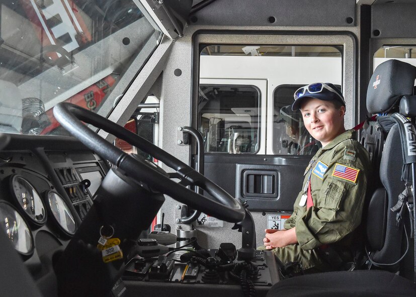 Honorary 2nd Lt. Corbin Burggraf, the 910th Airlift Wing’s 63rd Pilot for a Day, checks out the cabin of a fire crash and rescue truck before riding in the truck and operating its water turret here, June 29. The Pilot for a Day program welcomes children with life threatening or chronic illnesses to Youngstown Air Reserve Station for a day of fun military experiences. (U.S. Air Force photo/Eric White)