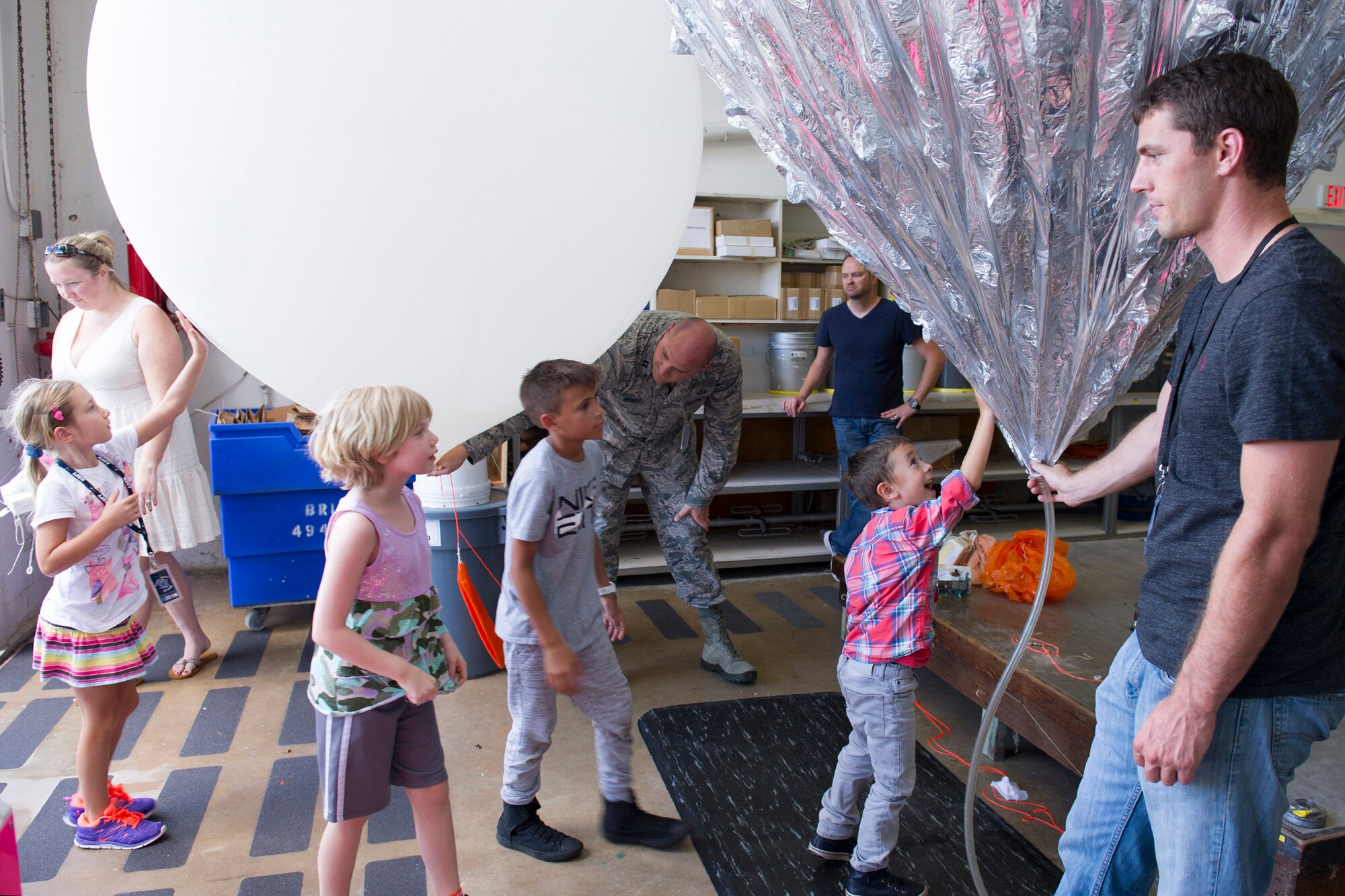 Members of the 45th Weather Squadron demonstrate how the weatherbot works during a Young Minds at Work session June 30, 2016, at Cape Canaveral Air Force Station, Fla. Children toured the Morrell Operations Center and learned about how the Air Force supports the unique operation for each rocket launch mission. Airmen teamed up with Lockheed Martin to showcase Air Force capabilities to encourage children to get interested in the study of Science, Technology, Engineering, and Math (STEM). (U.S. Air Force photo/Matthew Jurgens/Released)  