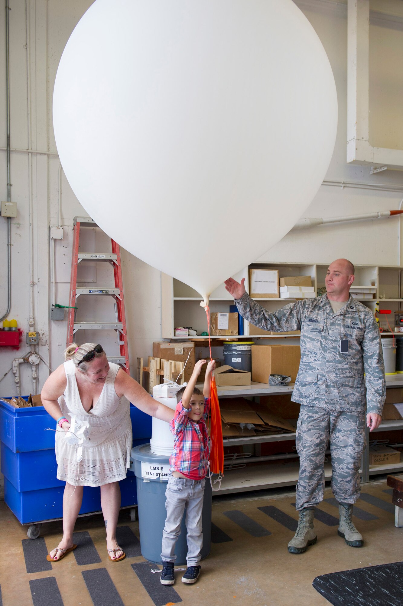 Members of the 45th Weather Squadron demonstrate how the weatherbot works during a Young Minds at Work session June 30, 2016, at Cape Canaveral Air Force Station, Fla. Children toured the Morrell Operations Center and learned about how the Air Force supports the unique operation for each rocket launch mission. Airmen teamed up with Lockheed Martin to showcase Air Force capabilities to encourage children to get interested in the study of Science, Technology, Engineering, and Math (STEM). (U.S. Air Force photo/Matthew Jurgens/Released)  
