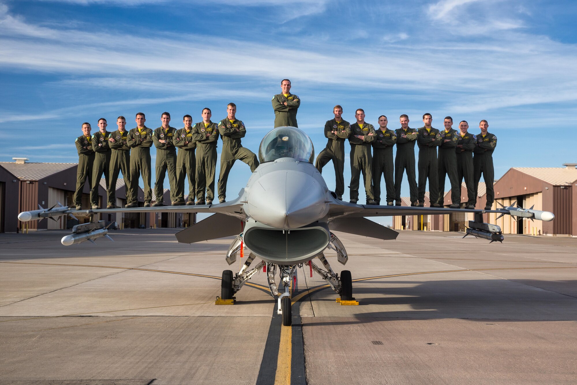 Class 15-BBH, the inaugural class from the 314th Fighter Squadron, stands on top of an F-16 Fighting Falcon at Holloman Air Force Base, N.M. Over 60 percent of the 17-man class will be going overseas following their June 25th graduation. (Courtesy Photo)