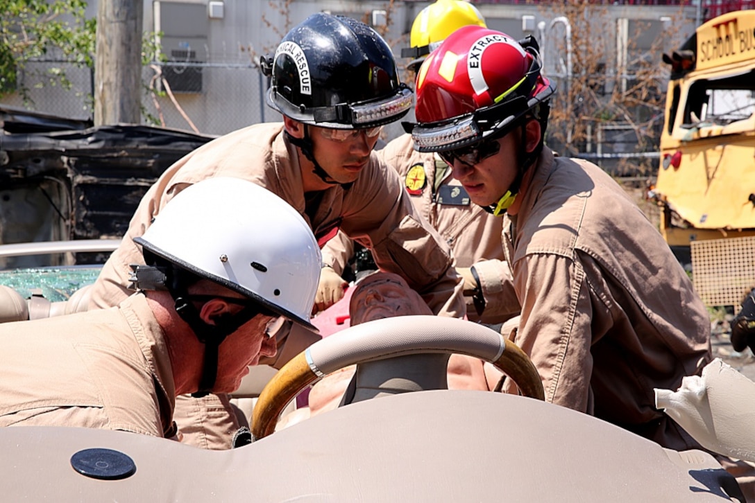 Marines with Chemical Biological Incident Response Force rescue a victim from a severely damaged vehicle at Fire Department of New York Fire Academy, June 21, 2016.
 Marines and sailors with CBIRF trained alongside F.D.N.Y for a field training exercise at the F.D.N.Y training academy in Randall’s Island, N.Y. June 20, 2016. CBIRF is an active duty Marine Corps unit that, when directed, forward-deploys and/or responds with minimal warning to a chemical, biological, radiological, nuclear or high-yield explosive (CBRNE) threat or event in order to assist local, state, or federal agencies and the geographic combatant commanders in the conduct of CBRNE response or consequence management operations, providing capabilities for command and control; agent detection and identification; search, rescue, and decontamination; and emergency medical care for contaminated personnel. (Official USMC Photo by Lance Cpl. Maverick S. Mejia/RELEASED) 