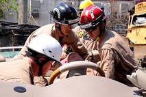 Marines with Chemical Biological Incident Response Force rescue a victim from a severely damaged vehicle at Fire Department of New York Fire Academy, June 21, 2016.
 Marines and sailors with CBIRF trained alongside F.D.N.Y for a field training exercise at the F.D.N.Y training academy in Randall’s Island, N.Y. June 20, 2016. CBIRF is an active duty Marine Corps unit that, when directed, forward-deploys and/or responds with minimal warning to a chemical, biological, radiological, nuclear or high-yield explosive (CBRNE) threat or event in order to assist local, state, or federal agencies and the geographic combatant commanders in the conduct of CBRNE response or consequence management operations, providing capabilities for command and control; agent detection and identification; search, rescue, and decontamination; and emergency medical care for contaminated personnel. (Official USMC Photo by Lance Cpl. Maverick S. Mejia/RELEASED) 