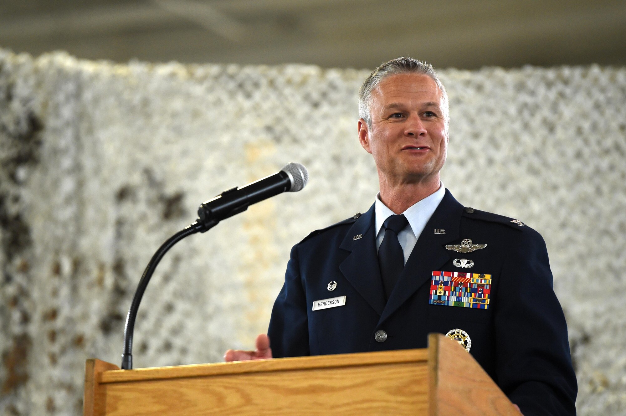 Col. Charles R. Henderson speaks during the 621st Contingency Response Wing Change of Command Ceremony at Joint Base McGuire-Dix-Lakehurst, New Jersey, June 29, 2016. Henderson is a command pilot with more than 3,300 flying hours. (U.S. Air Force photo by Tech. Sgt. Gustavo Gonzalez/Released)