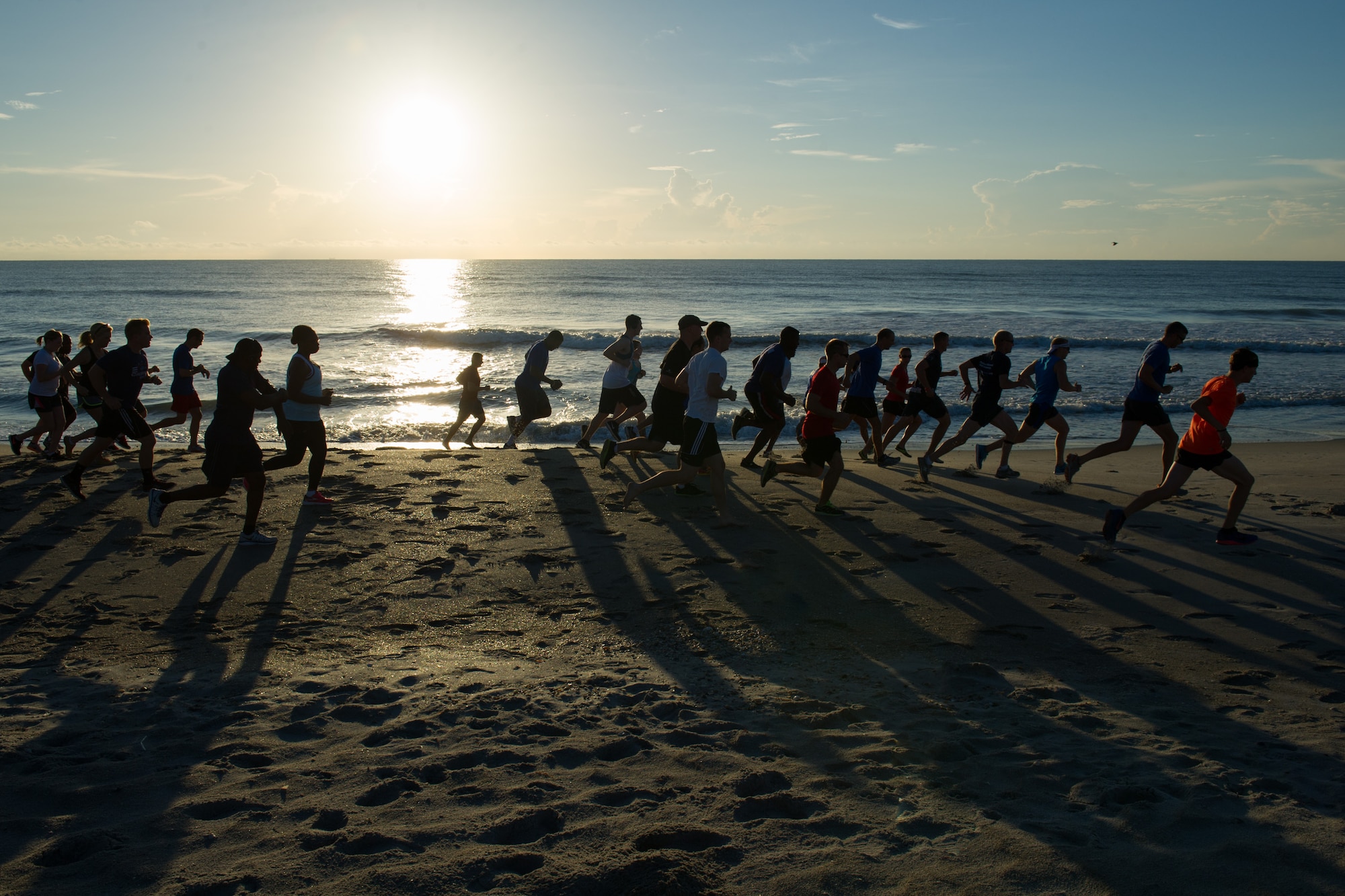 Members of the 45th Space Wing compete in a three mile run to celebrate America's 240th birthday June 30, 2016, at the Beach House Patrick Air Force Base, Fla. The 45th Force Support Squadron hosted the Independence Day Beach Run, including a sandbag circuit of repetitions, one for each year since the birth of the country. (U.S. Air Force photos/Benjamin Thacker/Released)