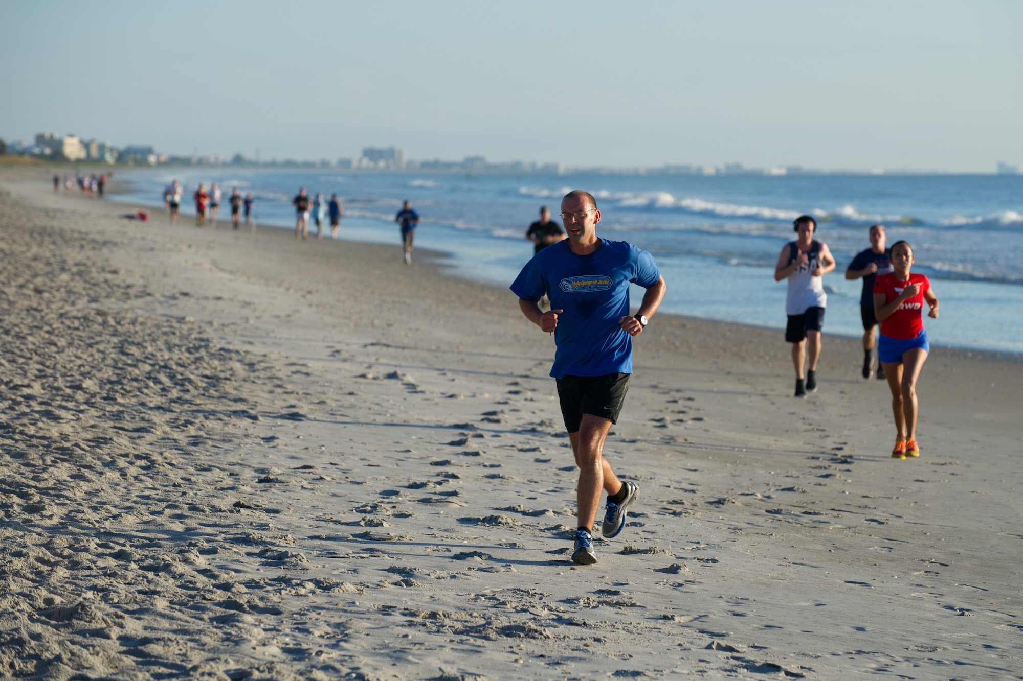 Members of the 45th Space Wing compete in a three mile run to celebrate America's 240th birthday June 30, 2016, at the Beach House Patrick Air Force Base, Fla. The 45th Force Support Squadron hosted the Independence Day Beach Run, including a sandbag circuit of repetitions, one for each year since the birth of the country. (U.S. Air Force photos/Benjamin Thacker/Released)