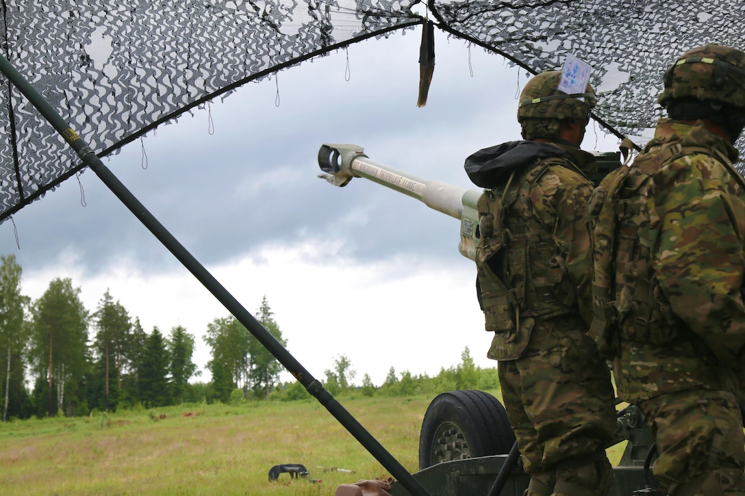 Soldiers conduct a howitzer fire mission rehearsal before participating in a combined forces live-fire exercise with multinational units during Saber Strike 16 in Tapa, Estonia, June 20, 2016. Army photo by Spc. Sandy Barrientos