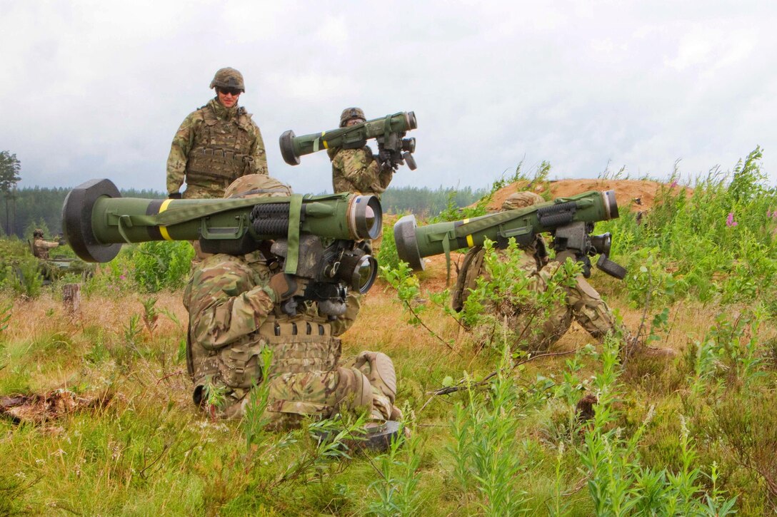Left to right: Army Cpl. Andrew Hernandez, Spc. Michael Chavez, and Spc. Blane Emory prepare to fire javelin anti-tank missiles downrange while their squad leader, Army Sgt. Stephen Morris looks on during Saber Strike 16 in Tapa, Estonia, June 20, 2016. Hernandez is a cavalry scout, Chavez is a gunner, Emory is a cavalry scout and Morris is a squad leader assigned to the 2nd Cavalry Regiment. Army photo by Staff Sgt. Jennifer Bunn  