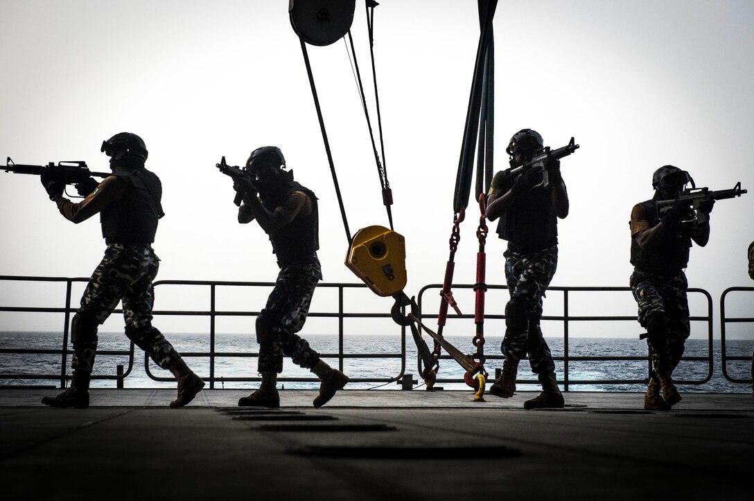 150320-N-JP249-034 GULF OF GUINEA (March 20, 2015) Nigerian military forces conduct bilateral visit, board, search and seizure training aboard the Military Sealift Command’s joint high-speed vessel USNS Spearhead (JHSV 1) during the maritime security exercise Obangame Express 2015, March 20. Spearhead is on a scheduled deployment to the U.S. 6th Fleet area of operations to support the international collaborative capacity-building program Africa Partnership Station. (U.S. Navy photo by Mass Communication Specialist 2nd Class Kenan O’Connor/Released)