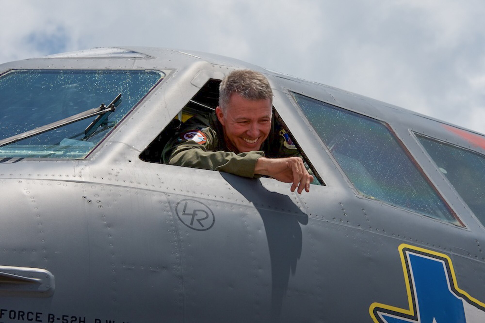 U.S. Air Force Col. Robert VanHoy, a member of the 307th Bomb Wing, smiles to his friends and family after his last mission as a pilot of the B-52 Stratofortress on July 19, 2016 at Barksdale Air Force Base, La. VanHoy is the former commander of the 93rd Bomb Squadron and will now be continuing his career with the 8th Air Force. (U.S. Air Force photo by Senior Airman Callie Ware/Released)