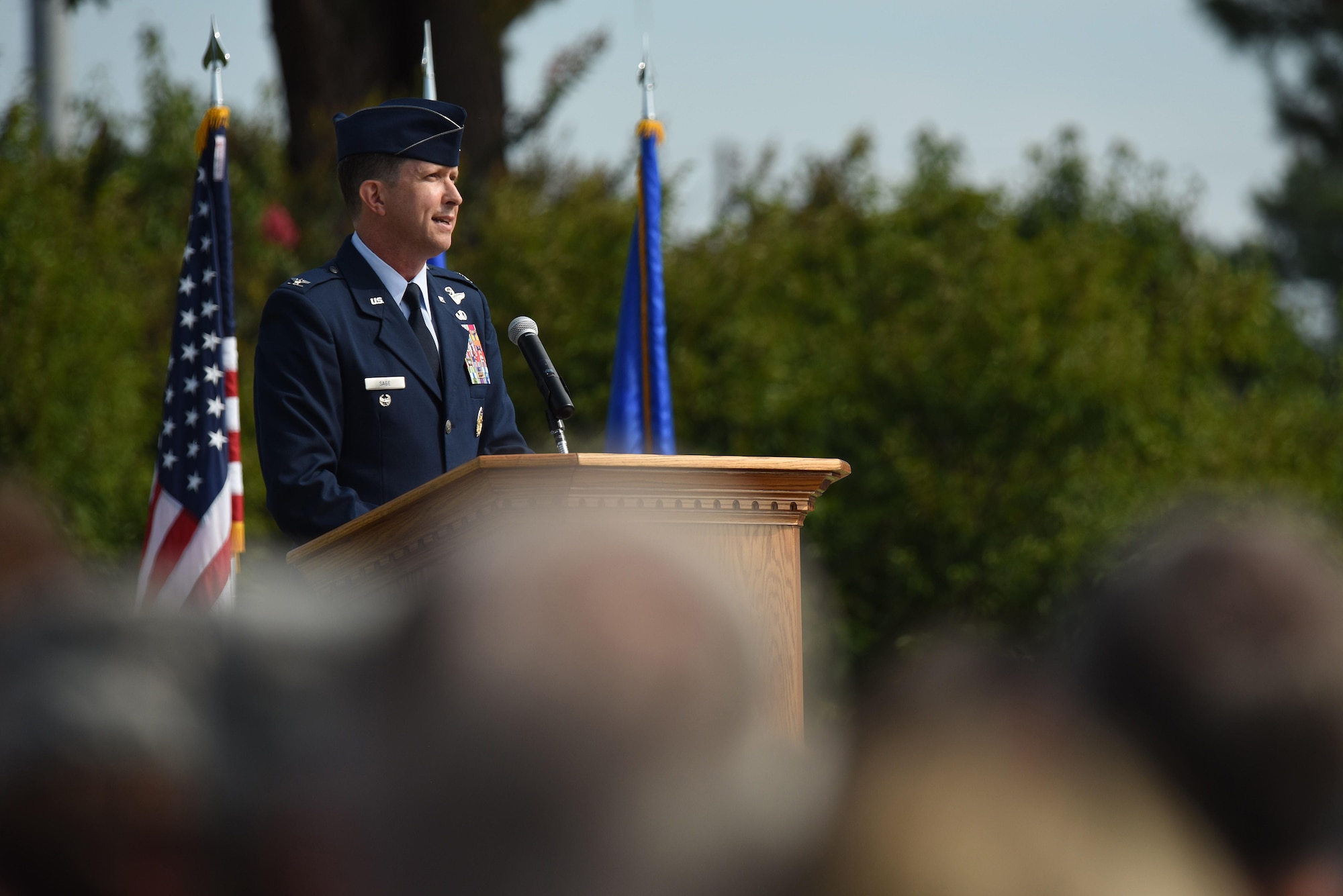 Col. Christopher Sage, 4th Fighter Wing commander, speaks to Airmen after assuming command of the 4th Fighter Wing, June 30, 2014, at Seymour Johnson Air Force Base, North Carolina. Sage has supported operations NORTHERN WATCH, DELIBERATE FORGE, ALLIED FORCE, ENDURING FREEDOM and IRAQI FREEDOM and has logged more than 4,100 flight hours during his 22-year career. (U.S. Air Force photo by Senior Airman Brittain Crolley)