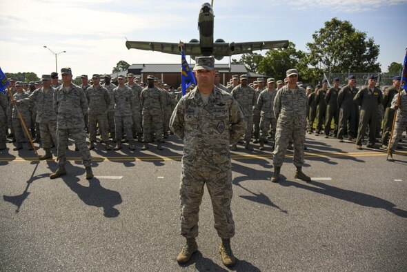 Airmen in formation stand at parade rest during the 4th Fighter Wing change of command ceremony, June 30, 2016, at Seymour Johnson Air Force Base, North Carolina. Col. Christopher Sage assumed command from Col. Mark Slocum during the ceremony. (U.S. Air Force photo/Senior Airman Brittain Crolley)