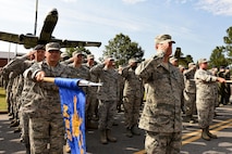 Airmen in formation salute during the 4th Fighter Wing change of command ceremony, June 30, 2016, at Seymour Johnson Air Force Base, North Carolina. Col. Christopher Sage assumed command from Col. Mark Slocum during the ceremony. (U.S. Air Force photo/ Airman 1st Class Ashley Williamson)