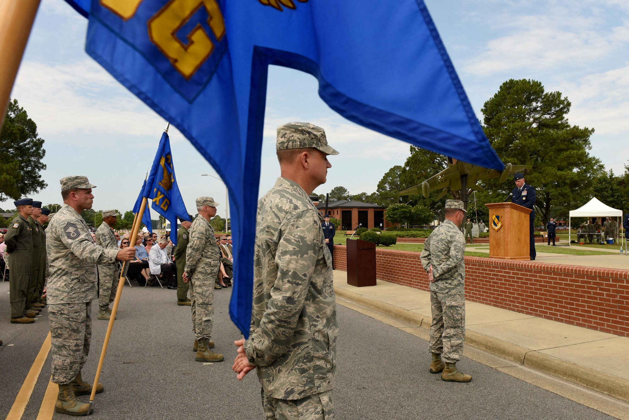 Airmen of the 4th Fighter Wing stand in formation during a change of command ceremony, June 30, 2016, at Seymour Johnson Air Force Base, North Carolina. Col. Christopher Sage, the former senior military assistant to the deputy chairman of the NATO Military Committee in Brussels, Belgium, assumed command from Col. Mark Slocum during the ceremony. (U.S. Air Force photo/Airman 1st Class Ashley Williamson)