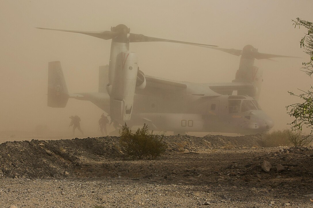 Marines of Company I, 3rd Battalion, 4th Marines, 7th Marine Regiment, exit an MV-22 Osprey with Marine Aircraft Group 39 as part of a Marine Air Ground Task Force Integration Exercise at the Chocolate Mountain Training Area, Yuma Ariz., June 22, 2016. This integration training tested the ground combat element and air combat element ability to work together to perform the insert of troops in defense of a territory. (Official Marine Corps photo by Cpl. Thomas Mudd/Released)