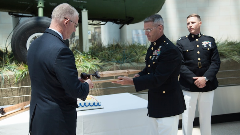 Bill A. Miller, left, and Brig. Gen. Christopher J. Mahoney exchange gifts during the Diplomatic Security Service Centennial ceremony at the National Museum of the Marine Corps in Triangle, Virginia, June 29, 2016. The ceremony also celebrated the 70th Anniversary of the Marine Corps Embassy Security Group, which has been working alongside the DSS since 1946. Miller is the director of DSS and Mahoney is the director of Strategy and Plans Division, Plans, Policies and Operations, Headquarters Marine Corps.