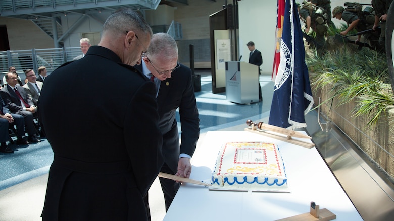 Brig. Gen. Christopher J. Mahoney, left, and Bill A. Miller cut a cake during the Diplomatic Security Service Centennial ceremony at the National Museum of the Marine Corps in Triangle, Virginia, June 29, 2016. The ceremony also celebrated the 70th Anniversary of the Marine Corps Embassy Security Group, which has been working alongside the DSS since 1946. Miller is the director of DSS and Mahoney is the director of Strategy and Plans Division, Plans, Policies and Operations, Headquarters Marine Corps.