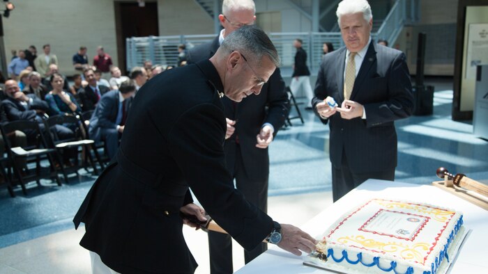 Brig. Gen. Christopher J. Mahoney, left, and Bill A. Miller cut a cake during the Diplomatic Security Service Centennial ceremony at the National Museum of the Marine Corps in Triangle, Virginia, June 29, 2016. The ceremony also celebrated the 70th Anniversary of the Marine Corps Embassy Security Group, which has been working alongside the DSS since 1946. Miller is the director of DSS and Mahoney is the director of Strategy and Plans Division, Plans, Policies and Operations, Headquarters Marine Corps.