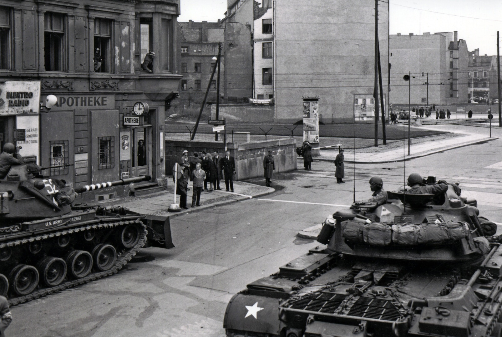 Soldiers from the U.S. Army Berlin Command face off against police from the former East Germany during one of several standoffs at Checkpoint Charlie in 1961. On several occasions that year, a U.S. quick reaction force of tanks and infantry Soldiers stood watch as armed military policemen escorted U.S. personnel across the border into East Berlin. (U.S. Army photo)