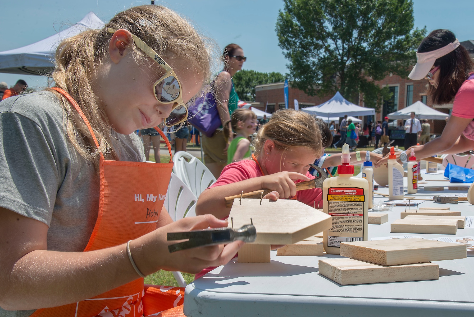 A family member of Team Scott inspects her handiwork at the Free Kids Workshop during the Annual Base Picnic June 24, 2016 at Scott Air Force Base, Illinois. The base picnic was created to celebrate the base's and Air Force's diversity (U.S. Air Force Photo by Airman Daniel Garcia)
