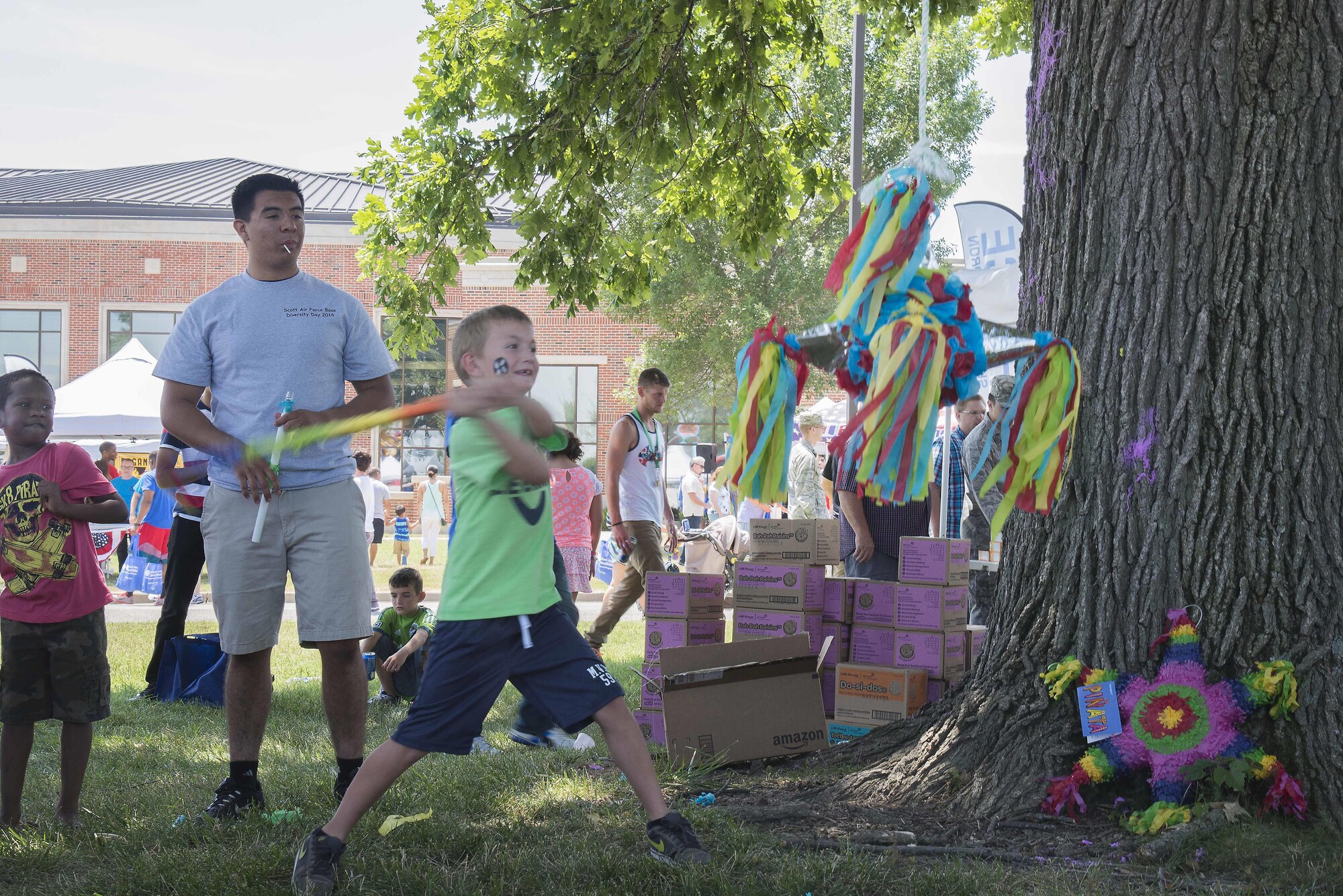 A family member of Team Scott takes a swing at a pinata during the Annual Base Picnic June 24, 2016 at Scott Air Force Base, Illinois. The event had informational booths from local and national businesses, as well as games, activites and food for Team Scott to enjoy. (U.S. Air Force Photo by Airman Daniel Garcia)