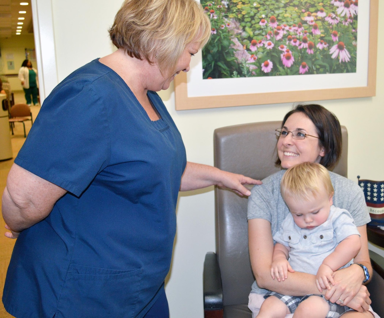 Lactation consultant Carolyn Lowe (left) talks with Bridget Owens about breastfeeding her baby, 16-month-old James Owens, during an appointment June 24 at Brooke Army Medical Center.