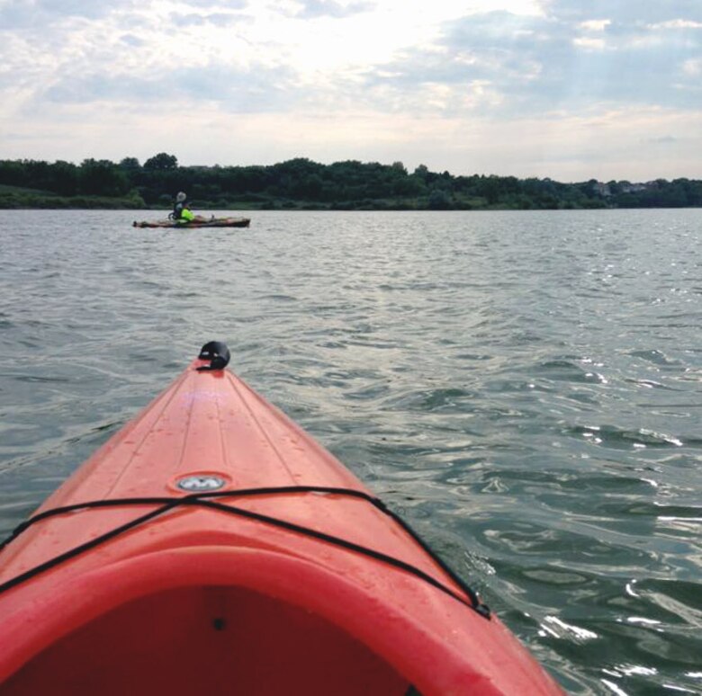 A kayaker at Lake Zorinsky enjoys an August afternoon. Visitors to Lake Zorinsky are reminded to Clean, Drain and Dry all items that enter and leave the water to help prevent the spread of zebra mussels.